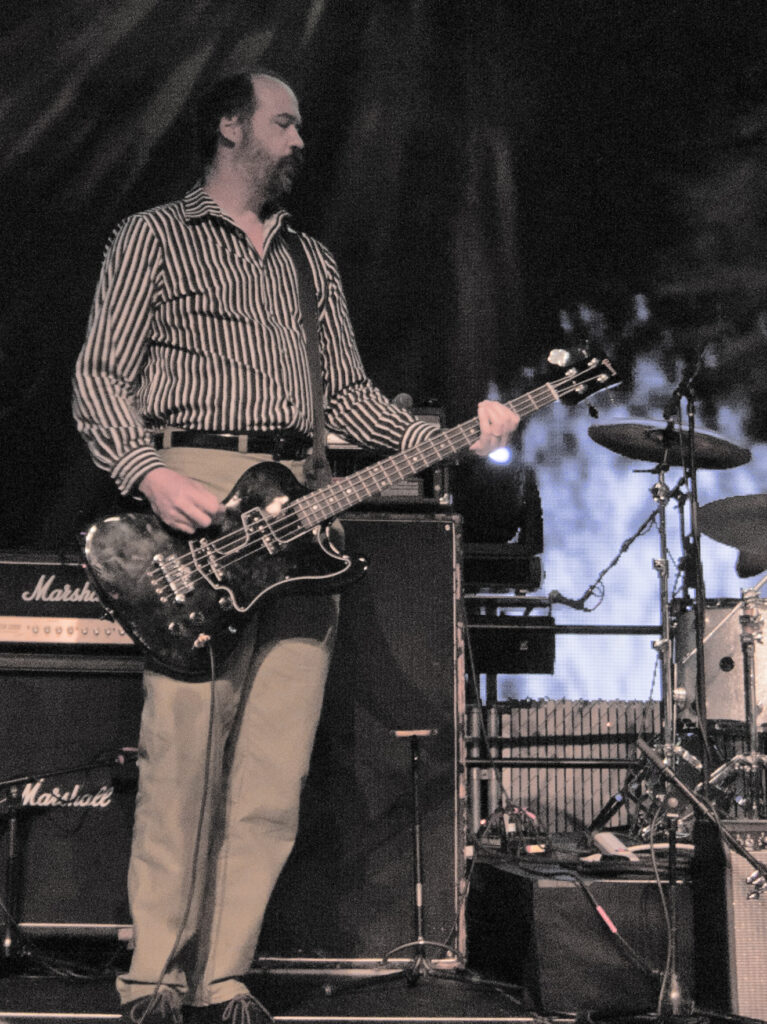 Krist Novoselic playing a black bass on stage at the Nevermind 20 Years celebration at EMP in Seattle, September 2011